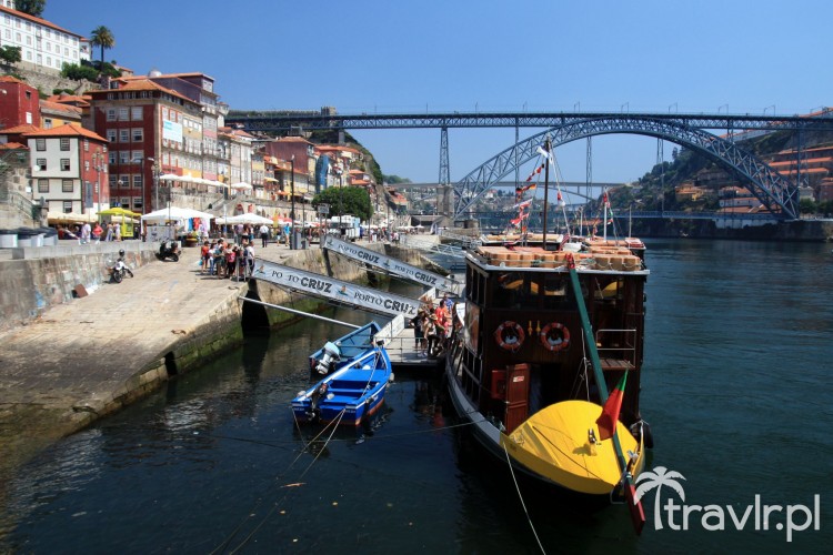 Colourful boats on the Douro river and the Dom Luis Bridge